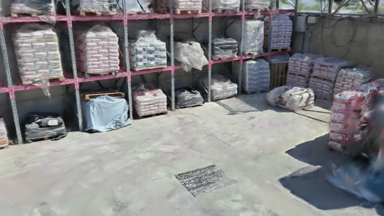 A building-materials yard twin, outdoor racks of palletised bags