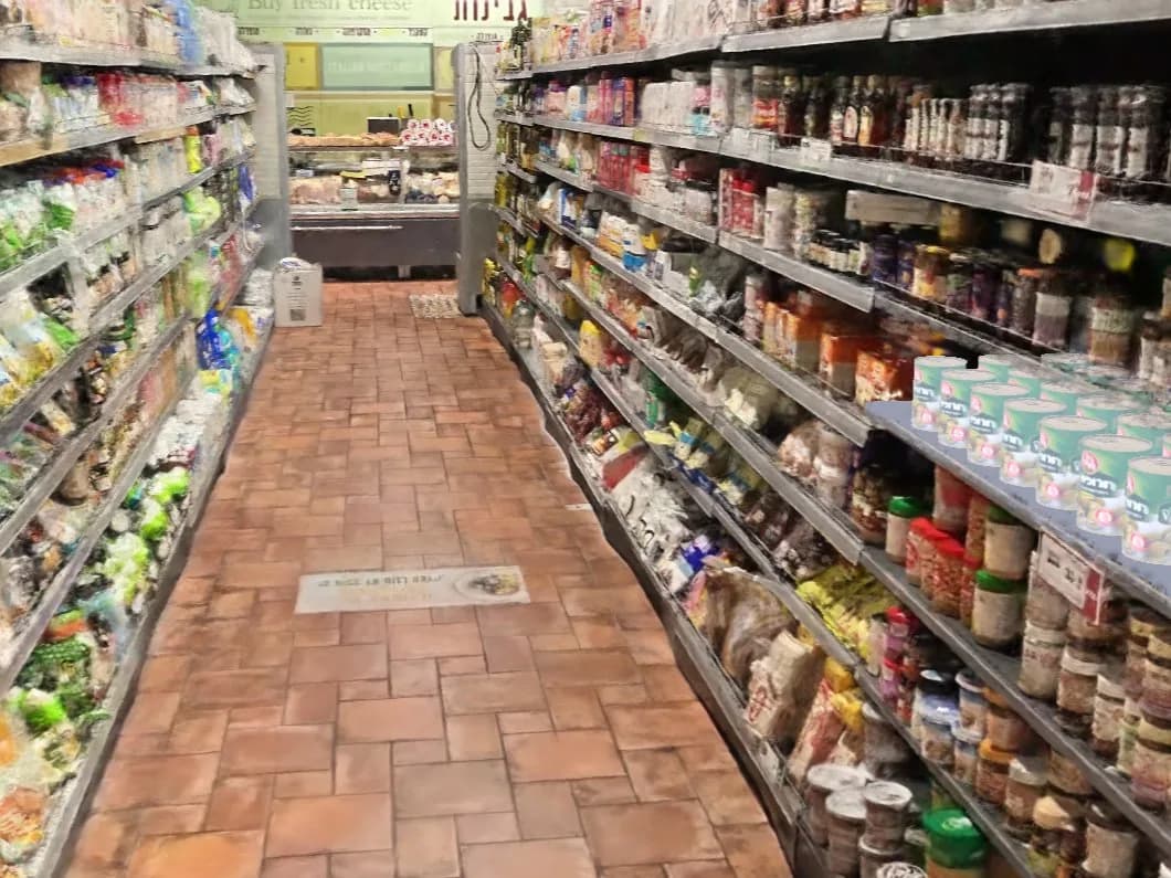 Supermarket aisle twin with cans placed on a shelf